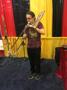 Daniel, testing a BBb contrabass at Thein's booth at TMEA 2019