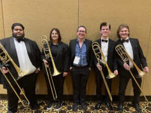 The UNC Wind Ensemble trombone section with Daniel at CMEA 2025
